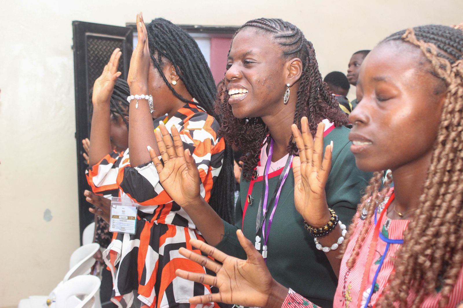 Worshippers lifting their hands in praise