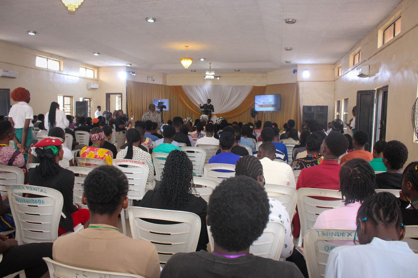 A full auditorium listening during a session