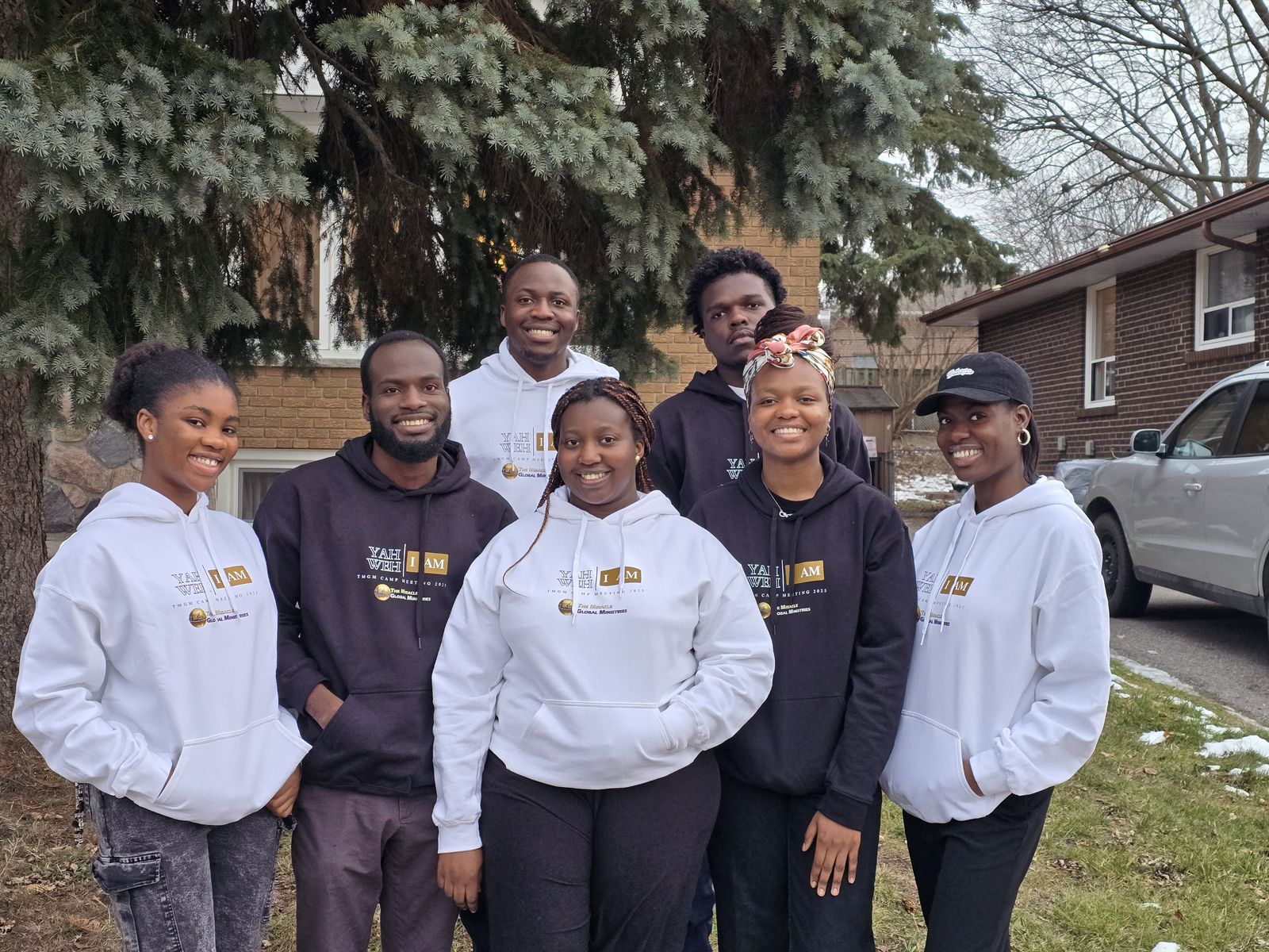 Members of the International Region together outdoors in matching hoodies