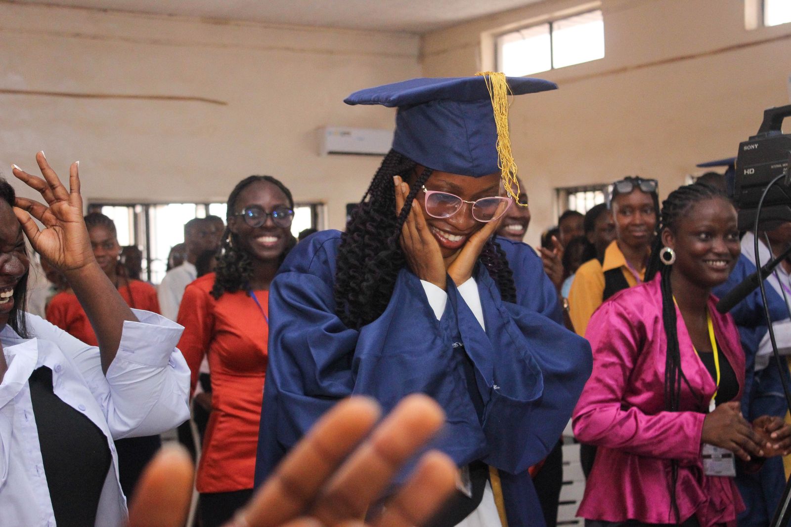 A graduate overcome with emotion during the ceremony