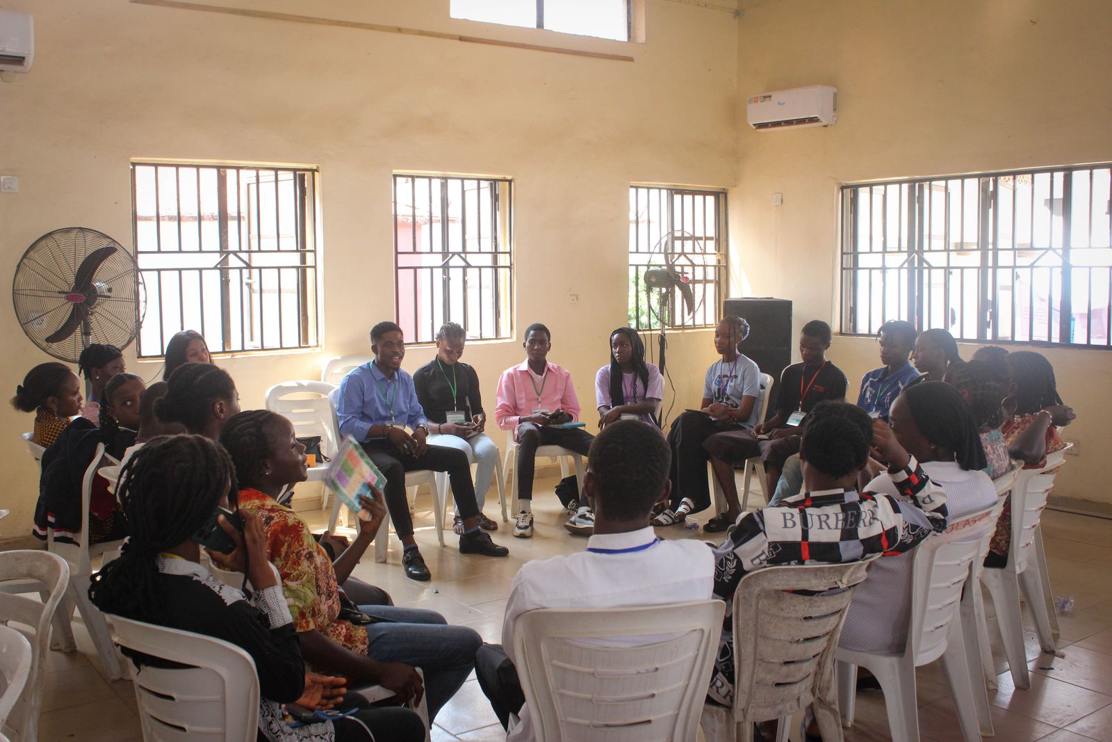 Attendees seated in a circle for a small-group discussion