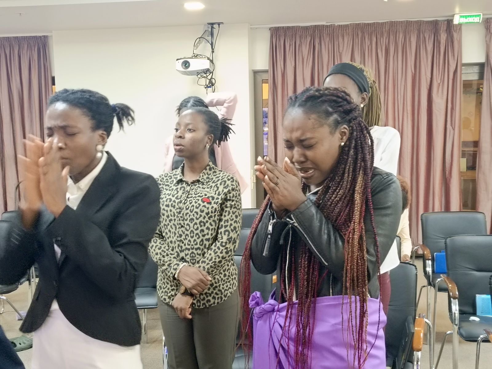 Women clapping and rejoicing in worship