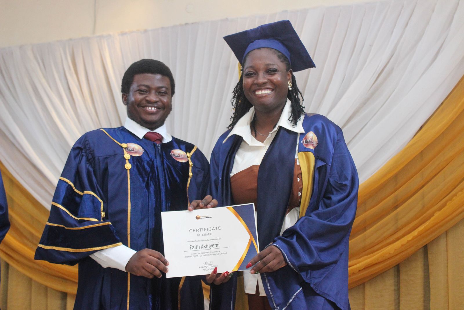 A graduate receiving her certificate on graduation day